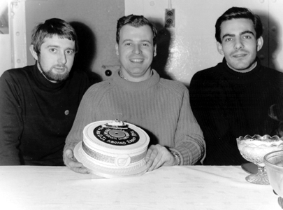 Stephen West, Edward Cole and Paul Beresford with a cake
